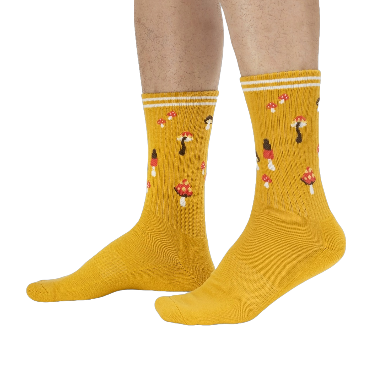 Lifestyle shot: A person's legs wearing the mustard yellow mushroom socks.