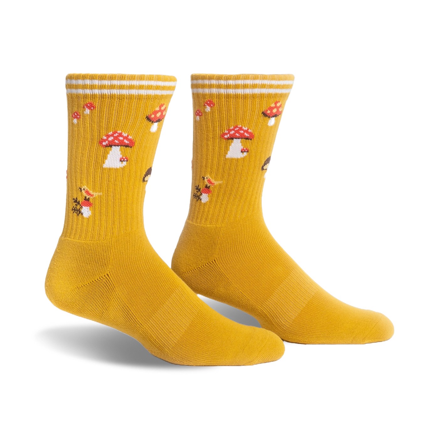 Pair of mustard yellow crew socks with a whimsical mushroom pattern. White stripes accent the cuff.