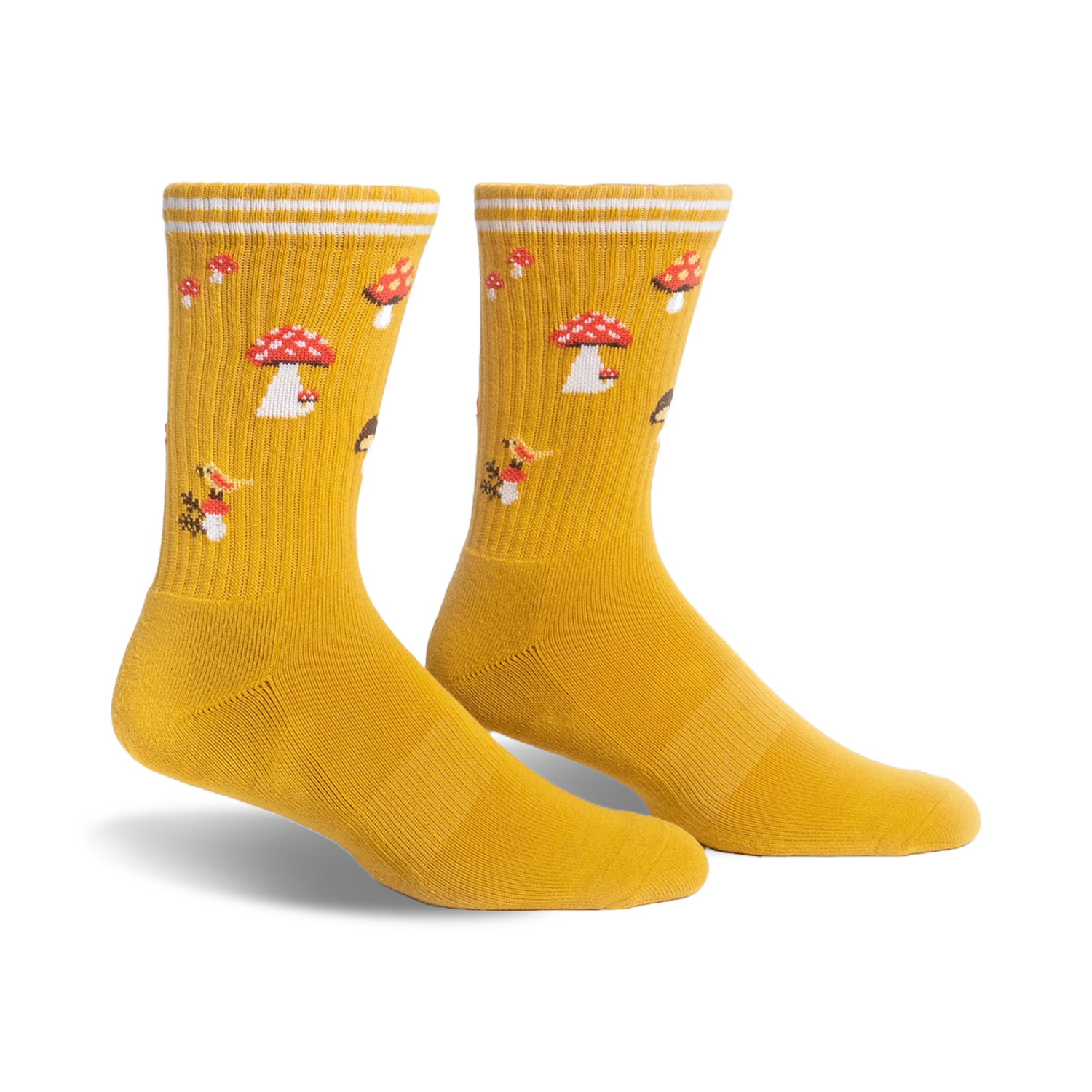 Pair of mustard yellow crew socks with a whimsical mushroom pattern. White stripes accent the cuff.