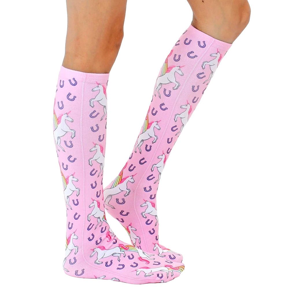 Lifestyle photo showcasing the pink unicorn socks on a person's legs, highlighting the sock's fit and pattern. [lf]