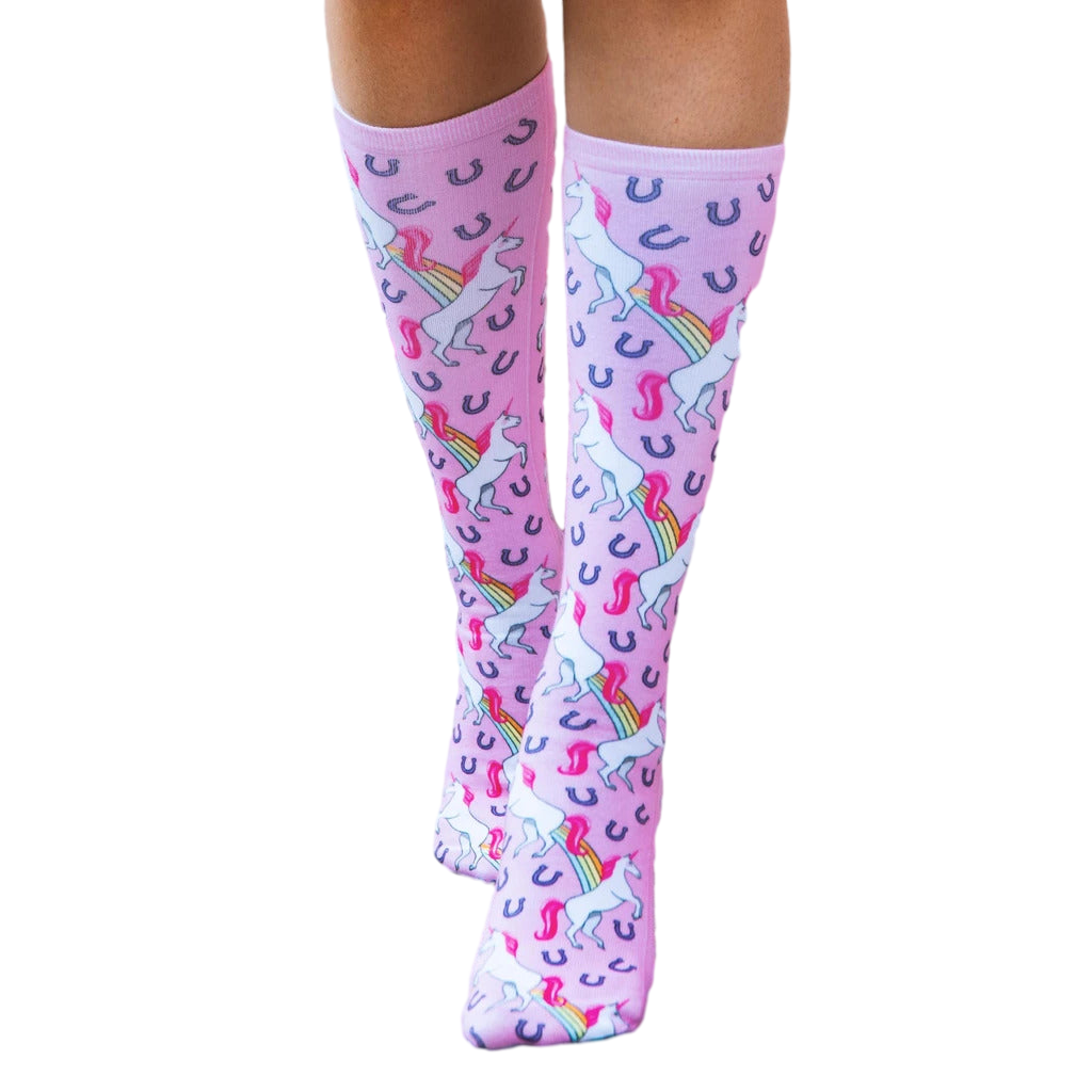 Close-up shot of the pink unicorn socks on a flat surface; highlighting the sock's color, design, and details. [lf]