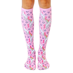 Pair of pink knee-high socks featuring a repeating pattern of white unicorns pooping rainbows and purple horseshoes. [lf]