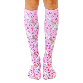 women's pink knee-high unicorn emoji socks with rainbows and horseshoes.   