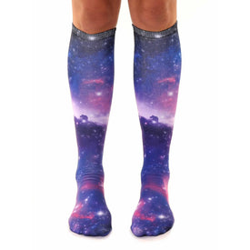 knee-high socks for men and women featuring a galaxy pattern in purple, blue, pink, and white.   