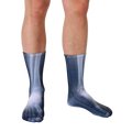 Lifestyle shot of X-Ray socks on a person's legs.  The socks' bone design is clearly visible. [lf]