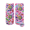 A pair of pink crew socks with a candy design.  Lollipops, gummy candies, and swirl candies are printed on a pink background with glitter accents.