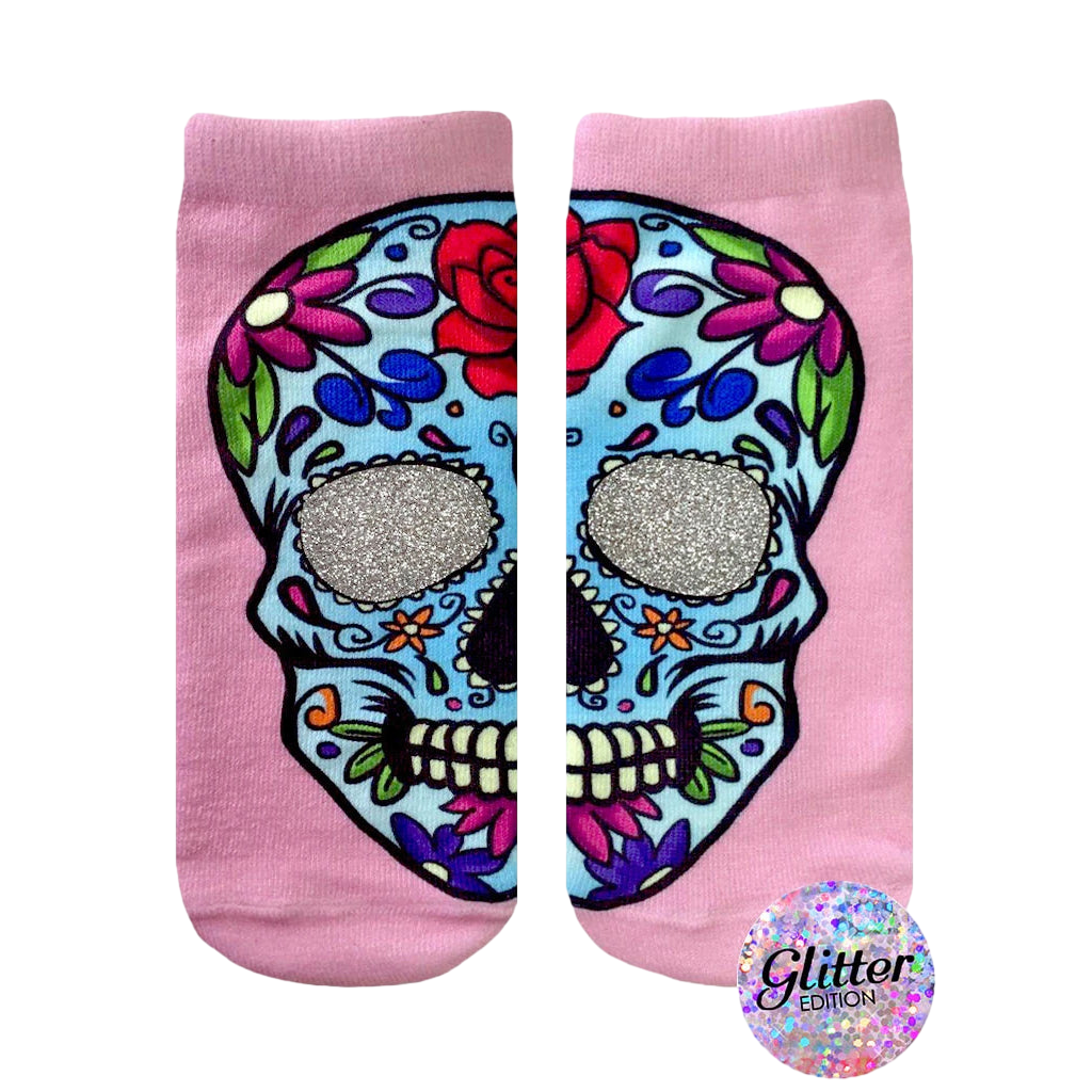 Pink ankle socks with a colorful sugar skull design. The skull's eye sockets are filled with silver glitter. [lf]