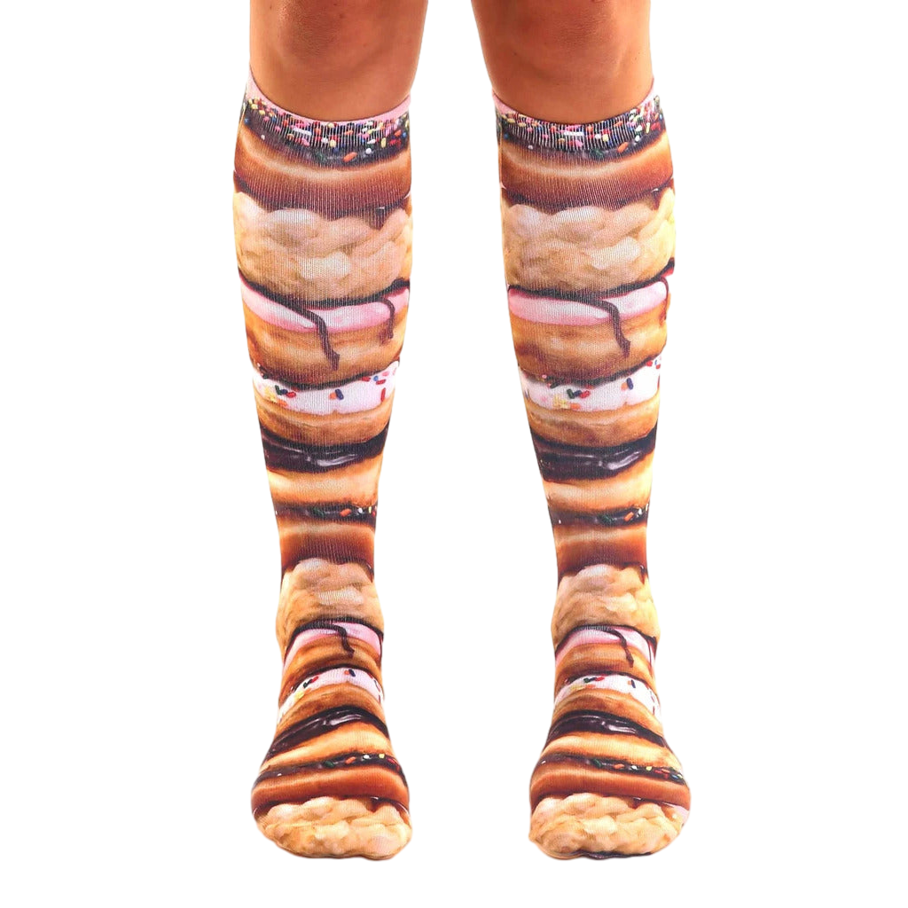 Pair of knee-high socks showcasing a stacked donut design.  Colors include browns, pinks, and sprinkles. [lf]
