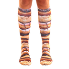 Pair of knee-high socks showcasing a stacked donut design.  Colors include browns, pinks, and sprinkles. [lf]
