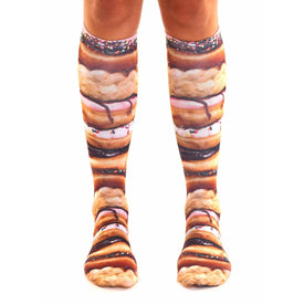 pink, brown, white stacked donut pattern, icing, sprinkles, and chocolate frosting on high socks for men and women.  