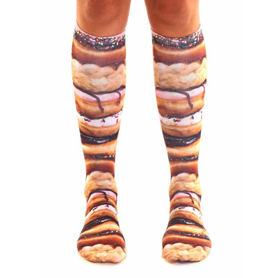 pink, brown, white stacked donut pattern, icing, sprinkles, and chocolate frosting on high socks for men and women.  