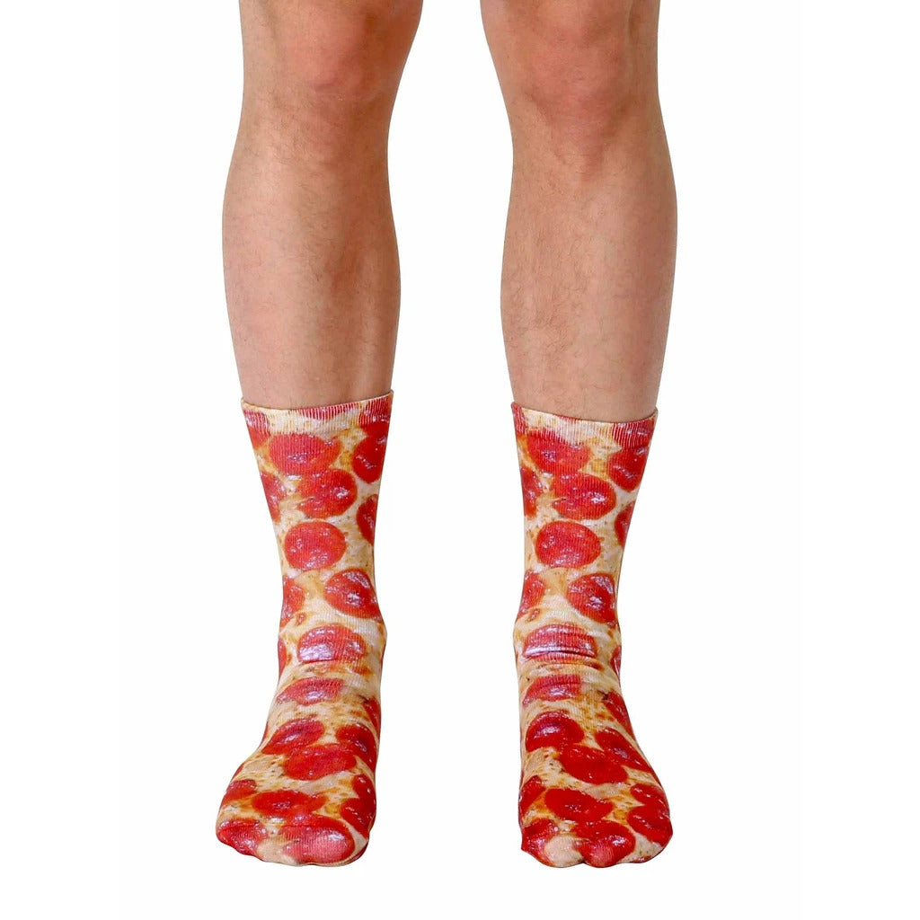 Pair of crew socks with a pepperoni pizza design.  Red, brown, and beige colors on a white background. [lf]