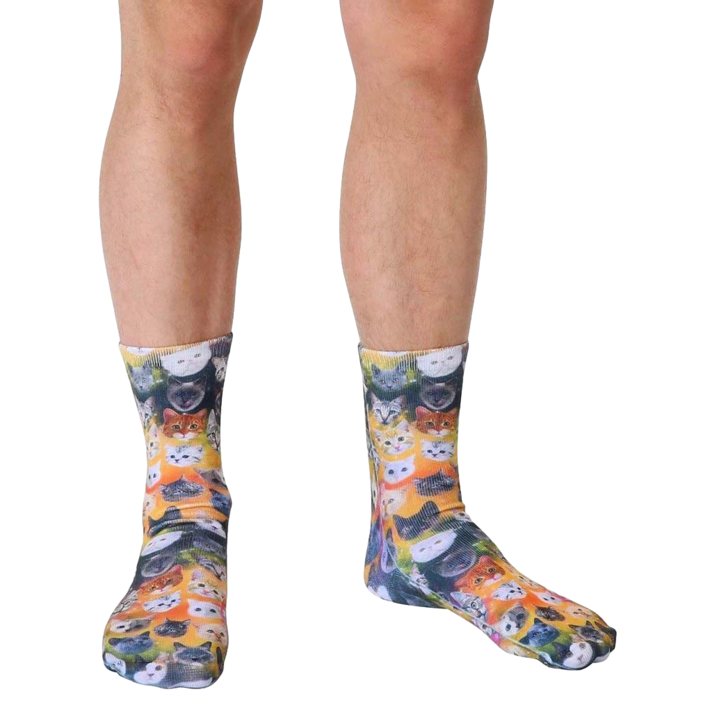 A close-up shot of Galaxy Kitty socks, highlighting the detailed cat faces and bright colors. [lf]