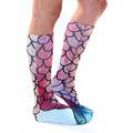 Lifestyle shot showing the mermaid socks on a model's legs from the side. [lf]