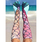 A pair of mermaid socks in a flat lay, showcasing the design detail. [lf]