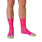 Lifestyle photo of legs wearing the watermelon socks. The socks are shown on a person's feet, and are slightly angled. [lf]