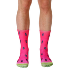 Pair of crew socks with a vibrant watermelon slice print.  Red, pink, black, and green colors are featured. [lf]