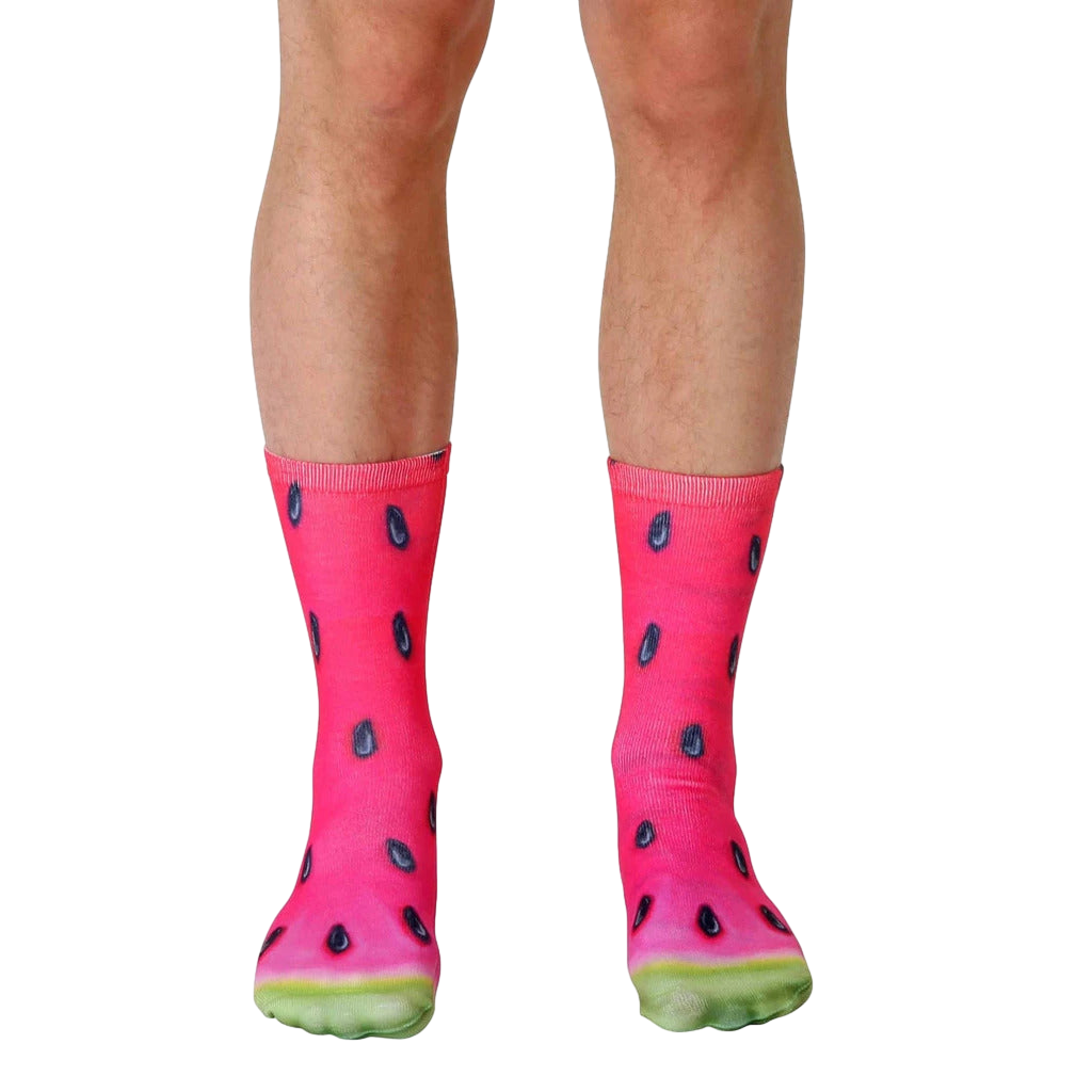 Pair of crew socks with a vibrant watermelon slice print.  Red, pink, black, and green colors are featured. [lf]
