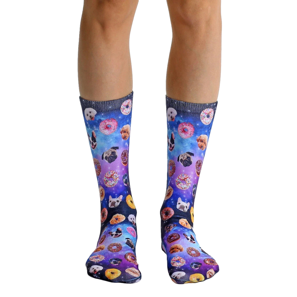 Crew socks featuring a galaxy print with donuts and various dog breeds.  Purple, blue, and black colors. [lf]