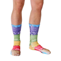 Lifestyle shot of a model's legs wearing the Ice Cream socks.  The socks are in focus against a white background. [lf]
