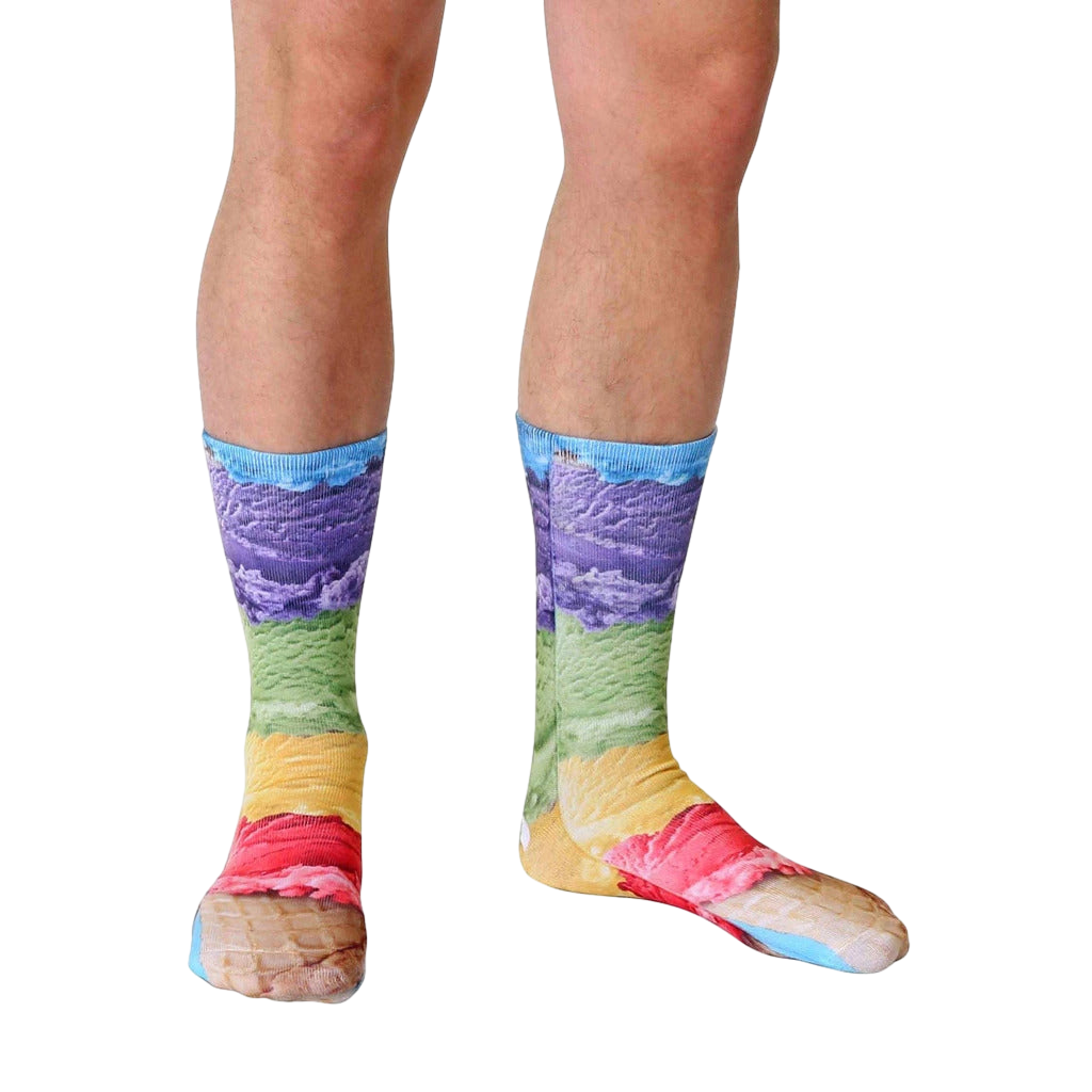 Lifestyle shot of a model's legs wearing the Ice Cream socks.  The socks are in focus against a white background. [lf]