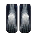 Pair of black ankle socks with a grayscale X-ray image of feet printed on them.  The design shows the bones of the feet in detail.