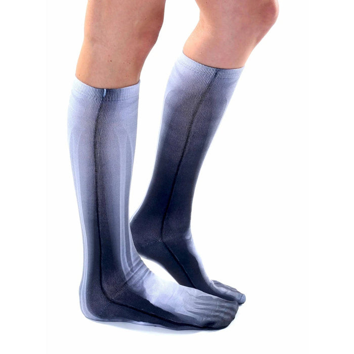 A pair of socks with an X-ray pattern of human legs and feet.