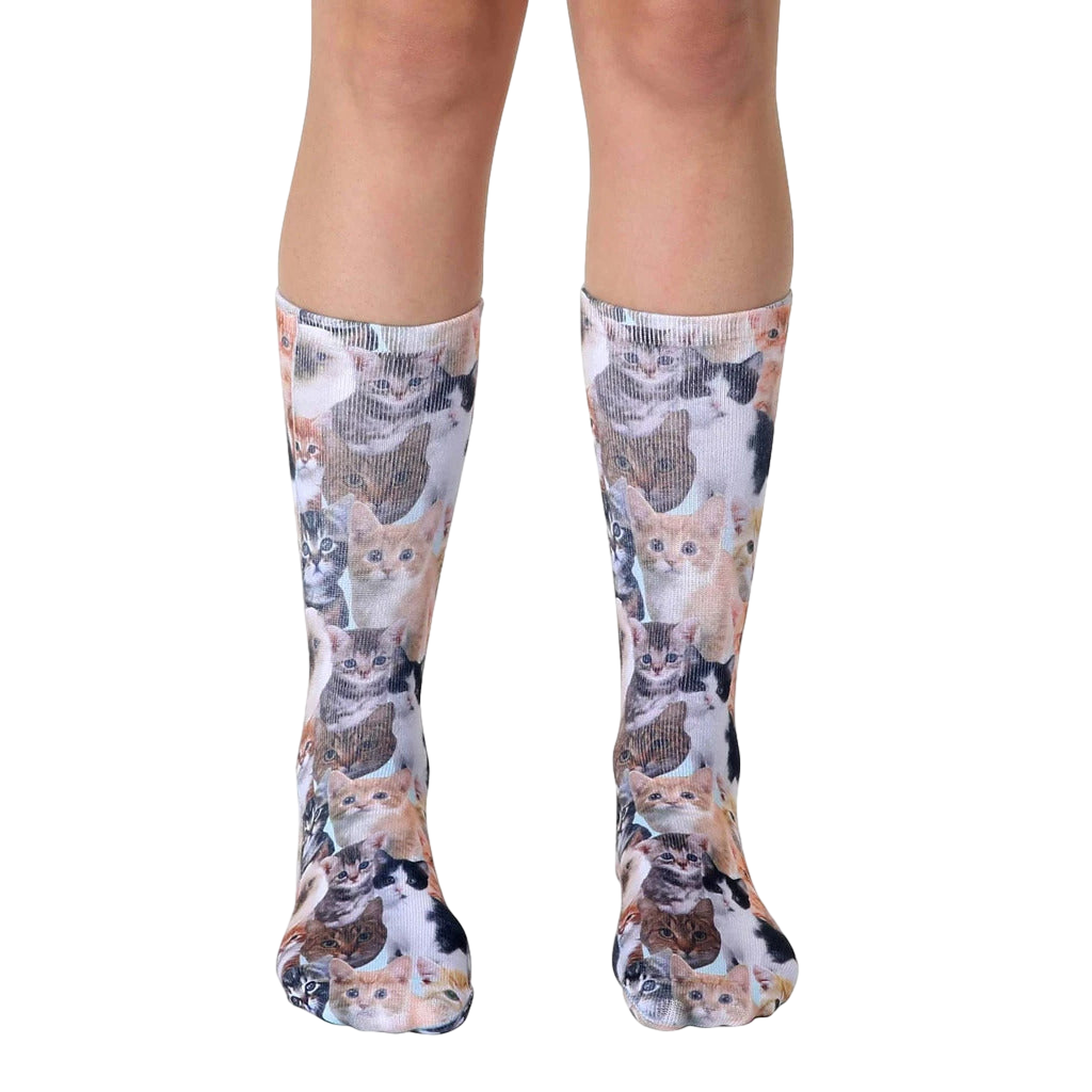 Crew socks featuring an all-over print of adorable kittens in various colors and poses on a light background. [lf]