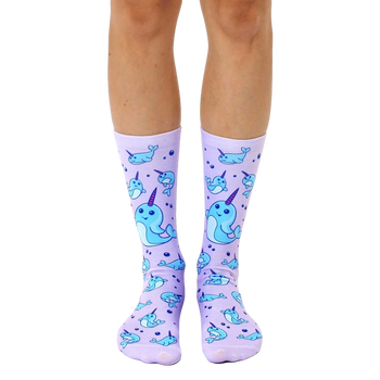 Lavender crew socks with a repeating pattern of light blue narwhals and bubbles. Fun and whimsical design. [lf]