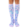 Pair of lavender knee-high socks with an all-over print of cute cartoon narwhals and bubbles. [lf]
