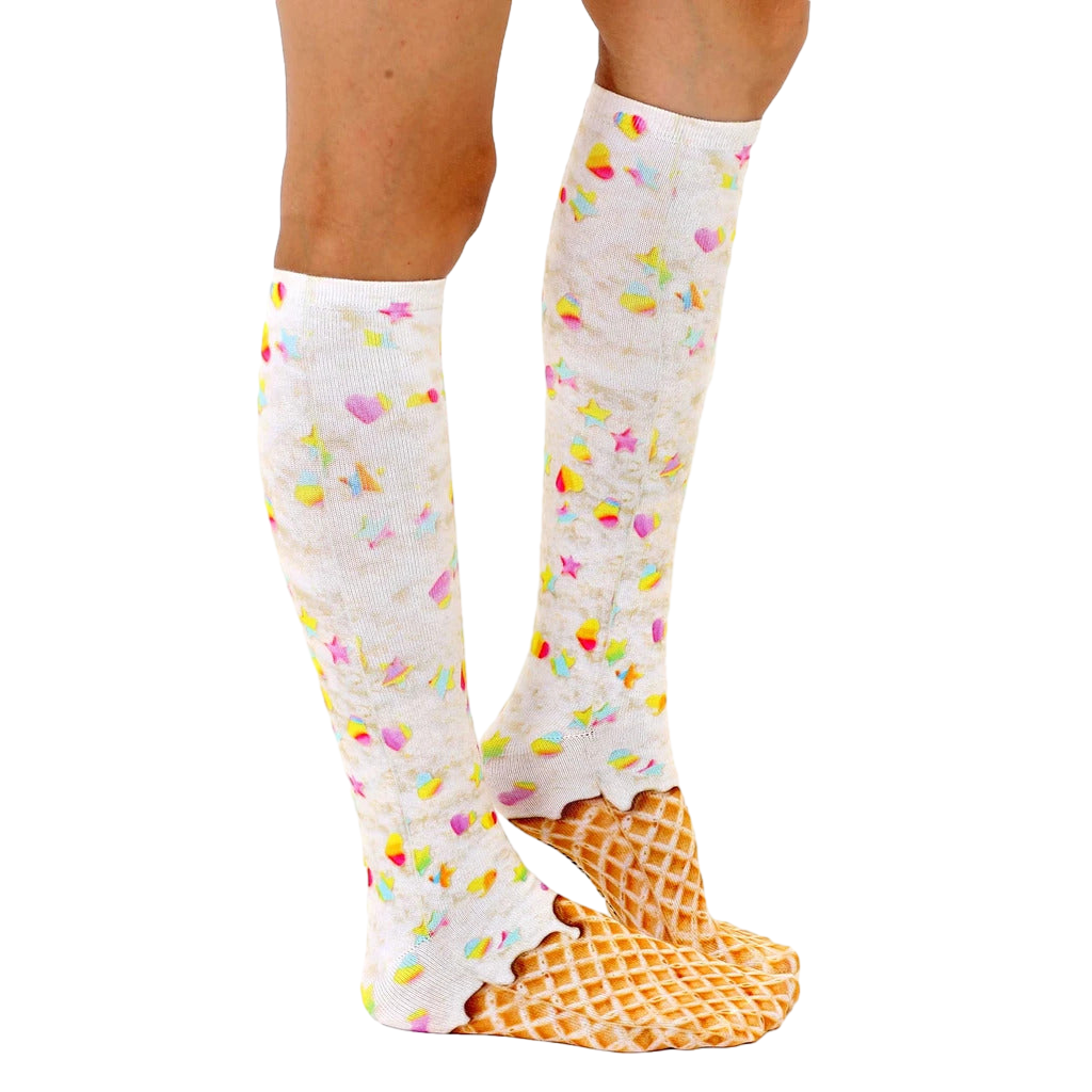 Lifestyle shot showing a person wearing the Rainbow Sprinkle Ice Cream knee-high socks. The socks are visible from the side. [lf]