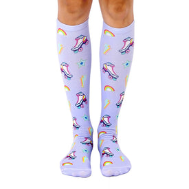 womens purple knee-high socks with white roller skates, rainbows, lightning bolts, and yellow stars themed for hobbies.  