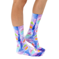 Lifestyle shot of model wearing the Slushie Universe socks; showing socks on feet, from the knees down. [lf]