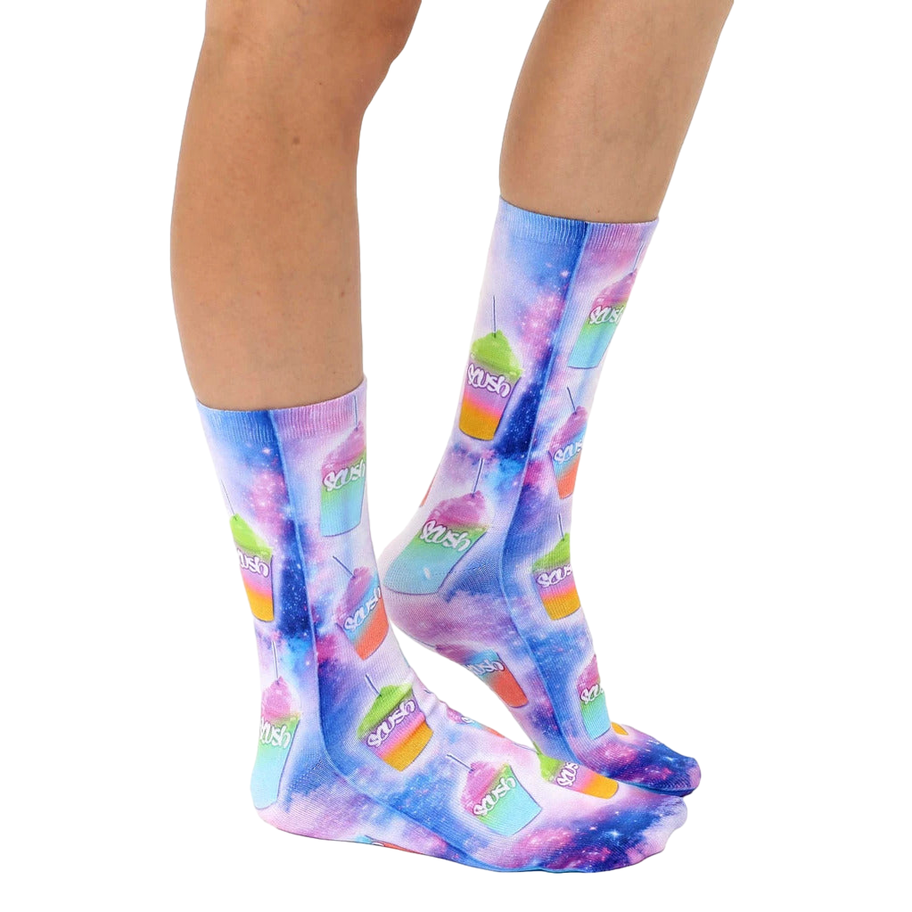 Lifestyle shot of model wearing the Slushie Universe socks; showing socks on feet, from the knees down. [lf]