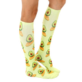 Lifestyle shot showing the socks on a person's legs, highlighting the length and fit of the Surfing Avocado socks. [lf]
