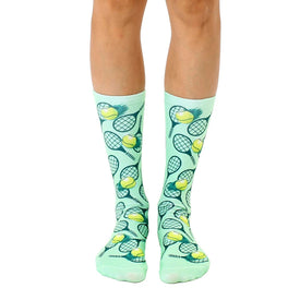 soft fuzzy mint green crew socks with yellow tennis balls and grey tennis rackets for men and women.  