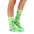Lifestyle shot of model wearing Trippy Pickle socks. Shows how they look when worn. [lf]