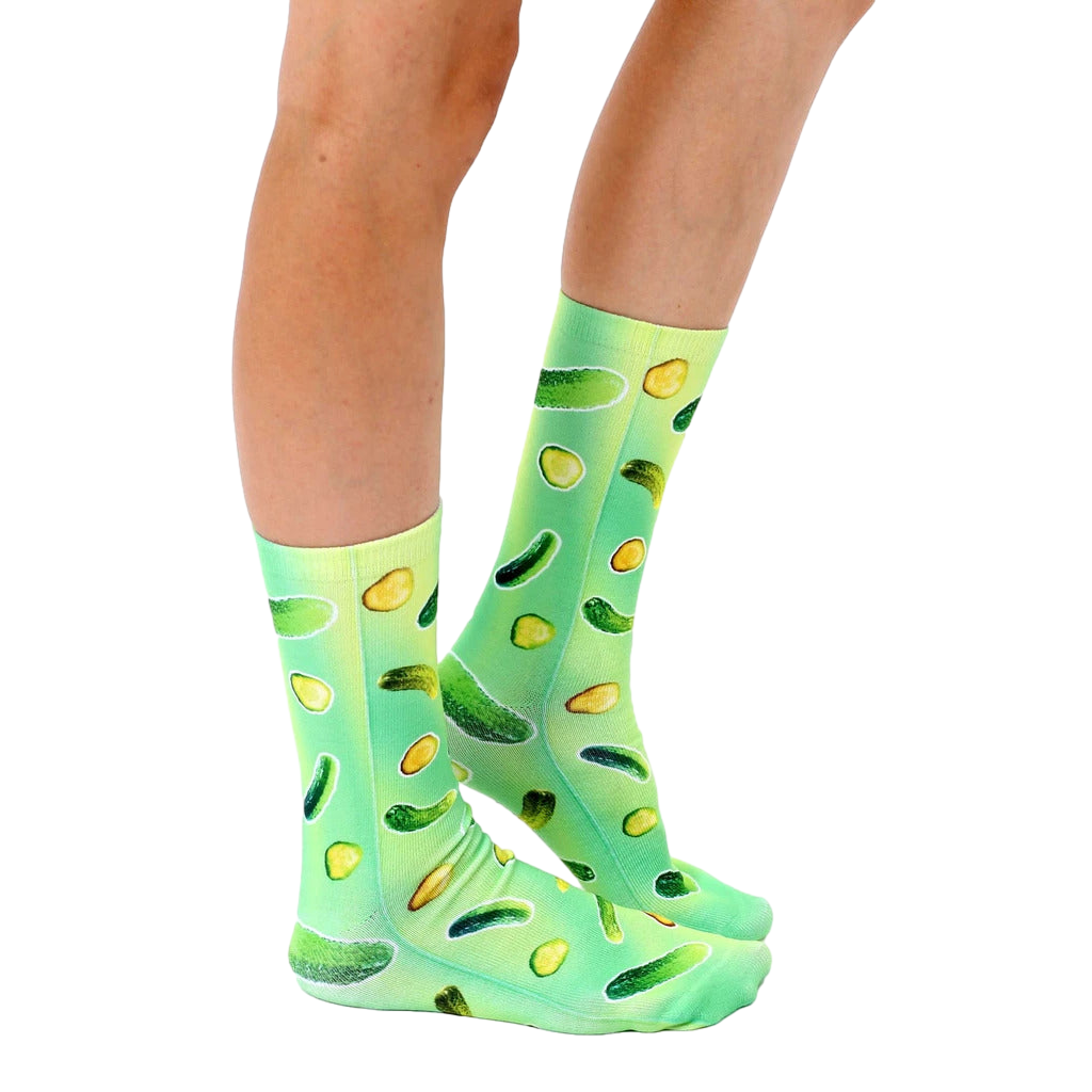 Lifestyle shot of model wearing Trippy Pickle socks. Shows how they look when worn. [lf]