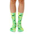 A pair of crew socks with a fun design. The socks are green and yellow with an all-over print of pickles of varying sizes. [lf]