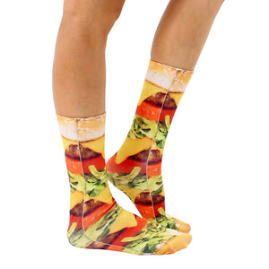 A pair of socks printed with a photorealistic image of a cheeseburger.