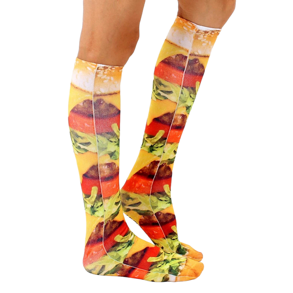 Lifestyle shot showing the knee-high burger socks on a person's legs, emphasizing the sock's length and design. [lf]