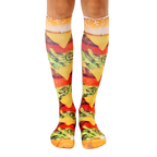 Pair of knee-high socks showcasing a realistic burger print.  Colors include yellows, browns, greens, and reds. [lf]