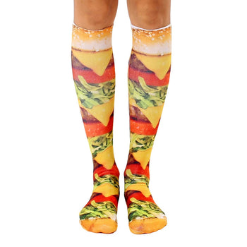 photorealistic cheeseburger print knee-high socks for men and women, featuring lettuce, tomatoes, and onions.   