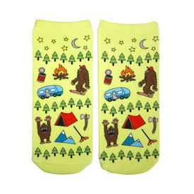 ankle socks with big foot toon images of a campfire, pine trees, camper van, tent and stars in green  