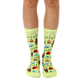 Lime green crew socks with a whimsical camping scene featuring Bigfoot, tents, campfires, and other outdoor elements. [lf]