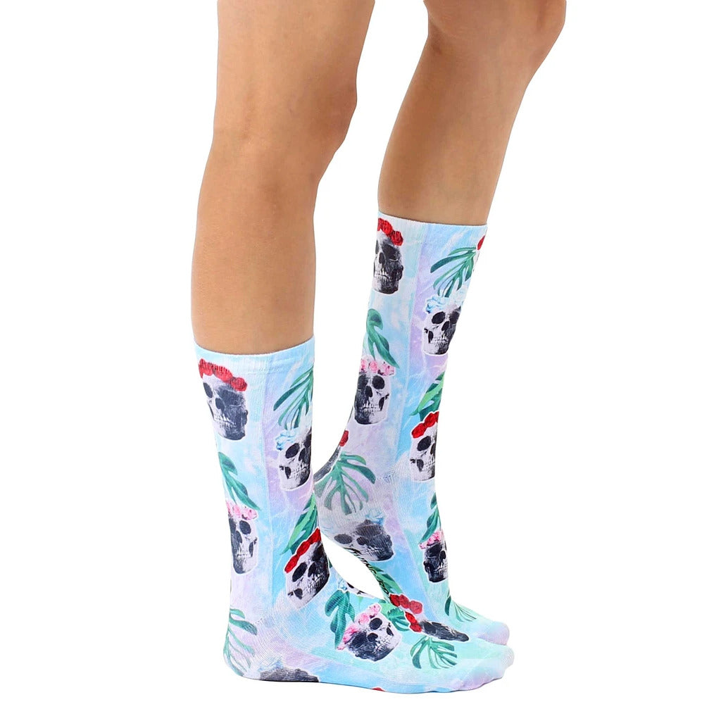 Lifestyle shot showcasing Floral Skull socks on a person's legs, highlighting the sock's fit and pattern in a more natural setting. [lf]