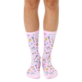 A pair of women's crew socks on a white background.  They're pink with a fun pattern of cartoon magic wands, crowns, and game controllers. [lf]