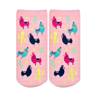 pink ankle socks for women featuring a pattern of blue, green, yellow, and black llamas wearing saddles and feathers against a backdrop of cacti.   