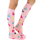 Lifestyle shot of model wearing pink llama socks; showcasing fit and style. [lf]