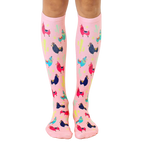 Pair of pink knee-high socks with colorful llamas and cacti print. Fun and whimsical design. [lf]